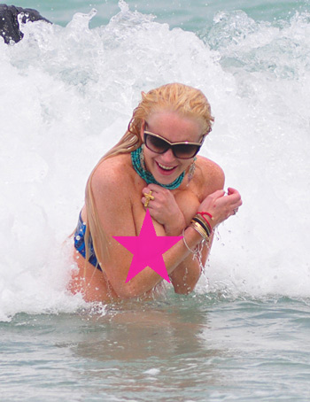 lindsay lohan miami surf. Lindsay Lohan Flashes a Nipple